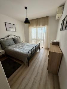 Postel nebo postele na pokoji v ubytování Apartamentos Sol da Luz