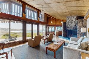 a living room with a couch and a fireplace at Curtis-Moulton Retreat in Sea Ranch