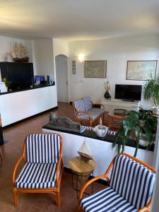 a living room with two chairs and a couch at Hotel Miriam in Sestri Levante
