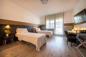 Postel nebo postele na pokoji v ubytování Bed & Bike Feltre