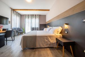 Postel nebo postele na pokoji v ubytování Bed & Bike Feltre