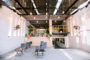 a room with chairs and tables in a building at Happy Home Hotel in Vung Tau