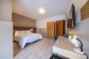 TV a/nebo společenská místnost v ubytování Bed & Bike Feltre