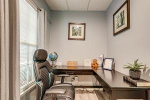 an office with a desk and a chair at Spacious Yard and BBQ Chic Escape in Lawrenceville! in Lawrenceville