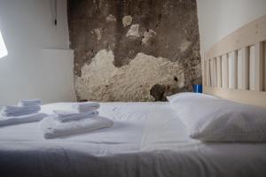 Postel nebo postele na pokoji v ubytování B&B Dimora Cigno