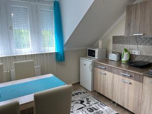 Kuchyňa alebo kuchynka v ubytovaní Silver Apartman