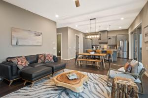 a living room with a couch and a table at Majestic Meadows in Boone