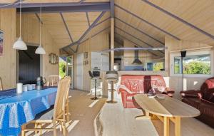 a kitchen and living room of a tiny house at Holiday Home Hvedemarken in Hejls