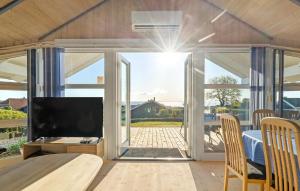 a room with a sliding glass door leading to a patio at Holiday Home Hvedemarken in Hejls
