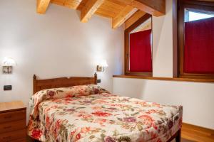 Postel nebo postele na pokoji v ubytování Residence Chalet Provenzale