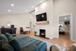 a living room with a couch and a fireplace at Buckeye Lake Cottage in Buckeye Lake