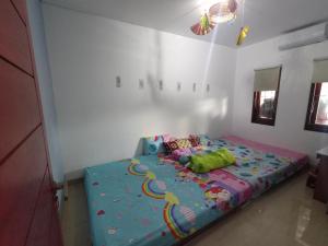 Postel nebo postele na pokoji v ubytování Designer Alex Villa Jimbaran Bali + 22 fotografií