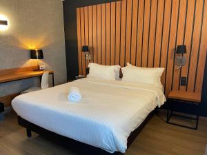 Postel nebo postele na pokoji v ubytování Best Western Côte des Sables Plouescat