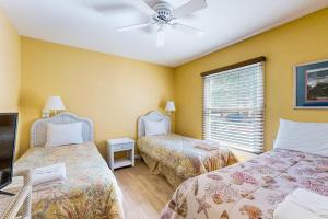 a bedroom with two beds and a ceiling fan at Sea Colony --- 16004 Bayberry Court in Bethany Beach