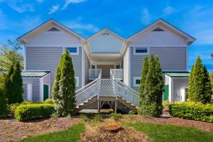 a large white house with trees in front of it at Sea Colony --- 16004 Bayberry Court in Bethany Beach