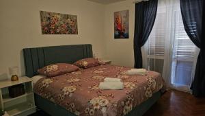 Postel nebo postele na pokoji v ubytování Apartments Gabriela