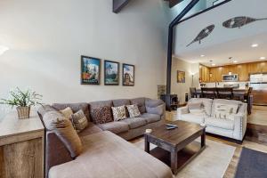 a living room with a couch and a table at St. Moritz 13 in Mammoth Lakes