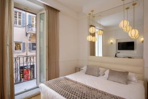 Giường trong phòng chung tại Relais Luxury Corso