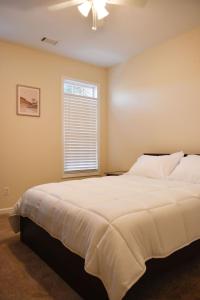 a bedroom with a large bed and a window at Marietta Hideaway in Marietta +33 photos