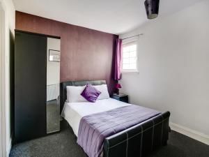 Postel nebo postele na pokoji v ubytování OYO Gin House Hotel
