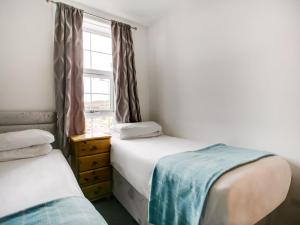 Postel nebo postele na pokoji v ubytování OYO Gin House Hotel