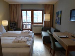 Postel nebo postele na pokoji v ubytování Hotel Teichwirt