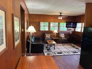a living room with a couch and a tv at Emma's Cottage #537 in Sevierville