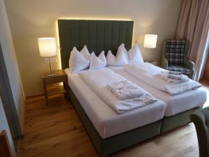 Postel nebo postele na pokoji v ubytování Hotel Teichwirt