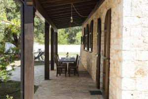 A patio or other outdoor area at trullo degli ulivi con piscina e vasca per bambini