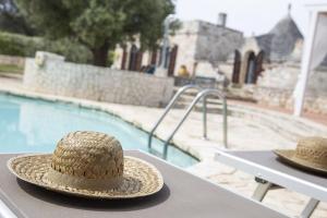 The swimming pool at or close to trullo degli ulivi con piscina e vasca per bambini