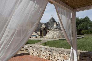 Kép trullo degli ulivi con piscina e vasca per bambini szállásáról San Michele Salentinóban a galériában
