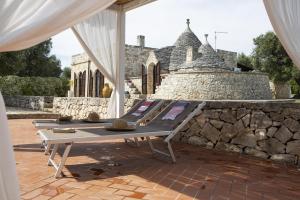 Kép trullo degli ulivi con piscina e vasca per bambini szállásáról San Michele Salentinóban a galériában