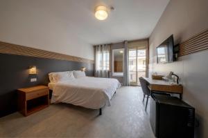 Postel nebo postele na pokoji v ubytování Bed & Bike Feltre