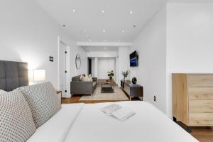 a bedroom with a bed and a living room at The SFX Old Port in Montreal