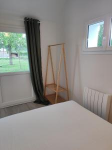 Giường trong phòng chung tại Gite du Verger