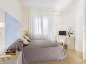 Postel nebo postele na pokoji v ubytování New Hotel Chiari