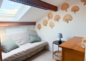 En eller flere senge i et værelse på Duplex la Baleine Bleue