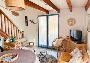 Et tv og/eller underholdning på Duplex la Baleine Bleue