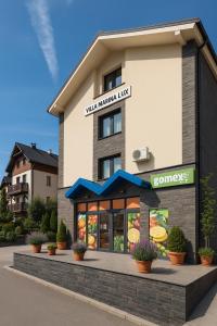 a rendering of a hotel with a restaurant at Lux apartman Zlatibor in Zlatibor