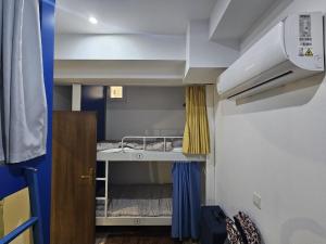 Postel nebo postele na pokoji v ubytování Hostel Renato