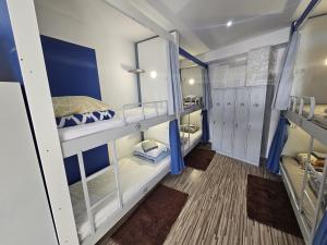 Postel nebo postele na pokoji v ubytování Hostel Renato