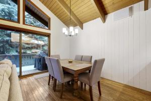 a dining room with a wooden table and chairs at Sun Valley Alpenglow in Ketchum