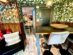 a room with a mirror and a table and a chair at Riojania La Posada in Santa Eulalia Bajera