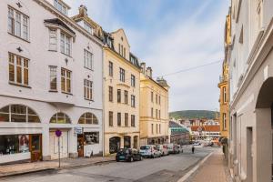 a city street with buildings and cars parked on the street at F7 l Architects Choice in Bergen