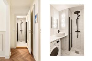 a bathroom with a washer and dryer next to a shower at F7 l Architects Choice in Bergen