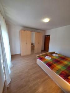 Postel nebo postele na pokoji v ubytování APARTMANI LANA