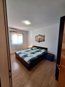 Postel nebo postele na pokoji v ubytování APARTMANI LANA