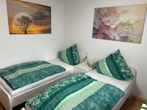 Postel nebo postele na pokoji v ubytování Gästezimmer Mia