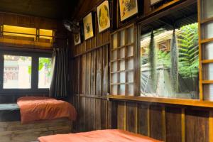 Giường trong phòng chung tại Thỏ Non Garden - Bảo Lộc Center 02