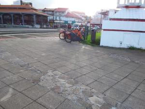 a group of bikes parked on the side of a street at coeur de Pointe-à-Pitre route du rhum 2022 in Pointe-à-Pitre